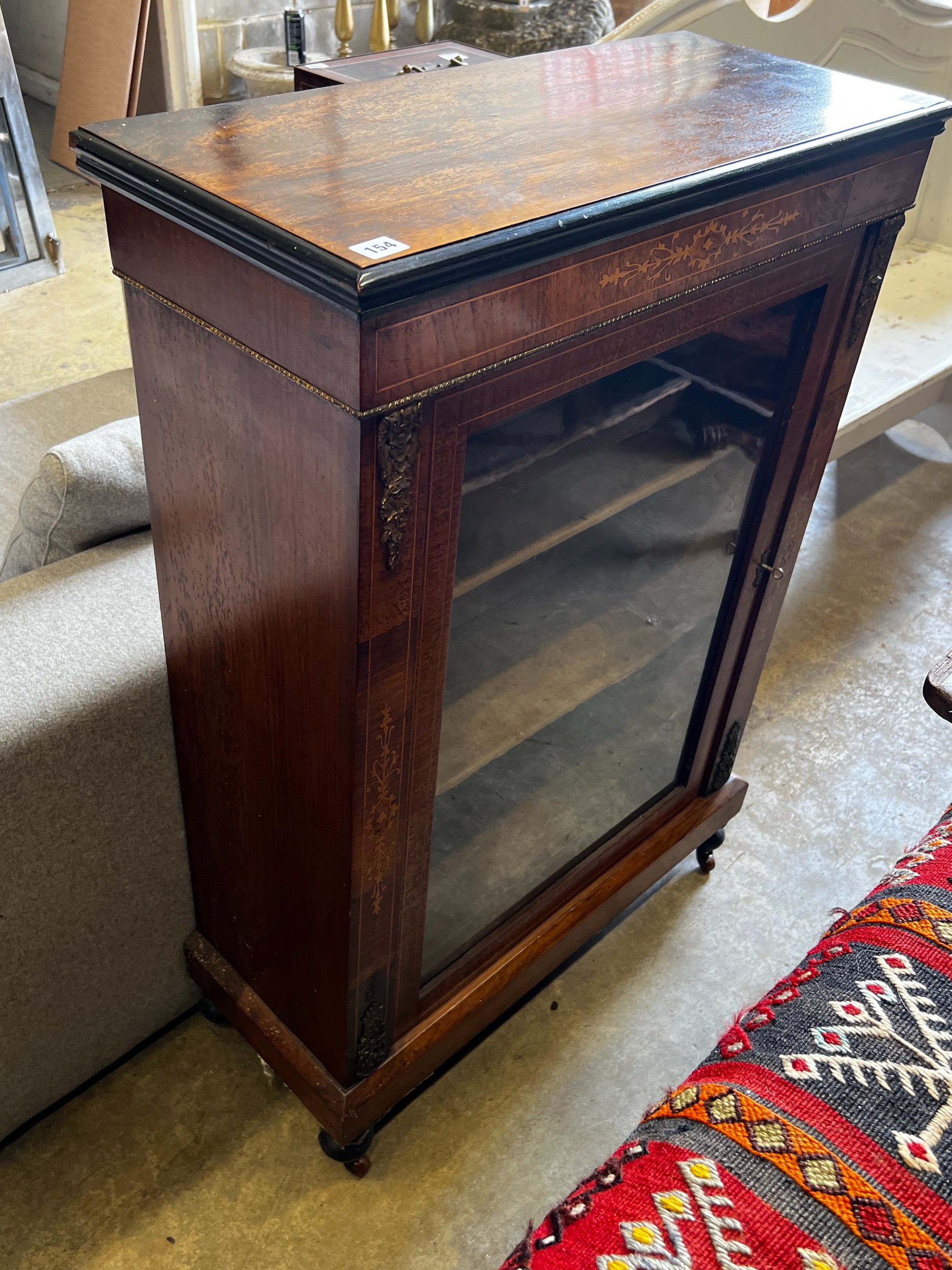A Victorian marquetry inlaid and gilt metal mounted glazed walnut pier cabinet, width 73cm, depth 31cm, height 108cm